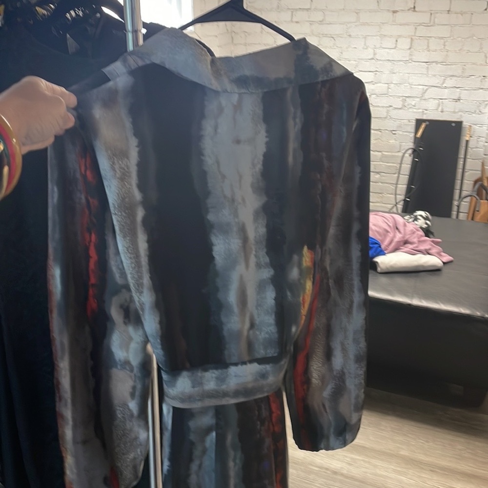 This is a show stopper. The attached belt gives the perfect wrap dress look.